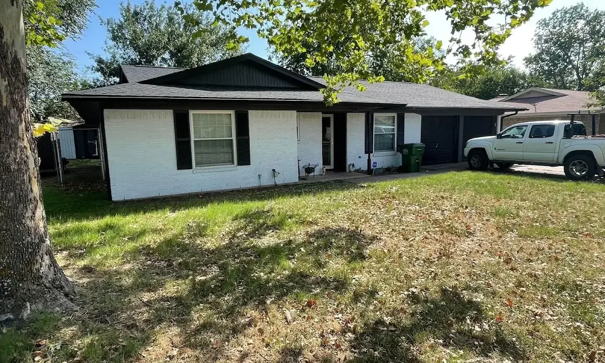 Professional roofing crew working on a residential roof in Spring Lake Park